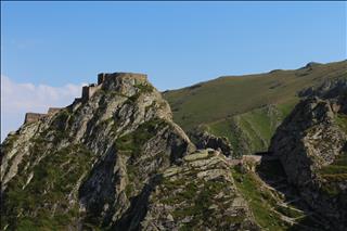 Green slopes surrounding the castle